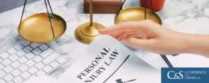 Scales of justice and a personal injury law document on the table