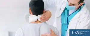Doctor looking at a fractured spinal cord