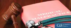 Medical malpractice law book and gavel