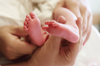 close up baby's feet being held by parent - birth injury lawyer