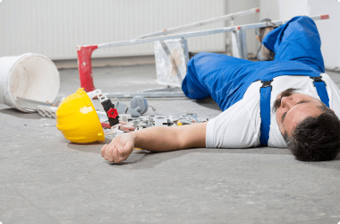 construction worker laying on floor following accident - construction accident lawyer