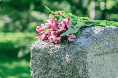 flowers on tombstone