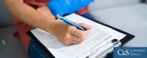 Injured worker filling out a compensation form
