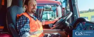 truck driving on highway with sunset in background