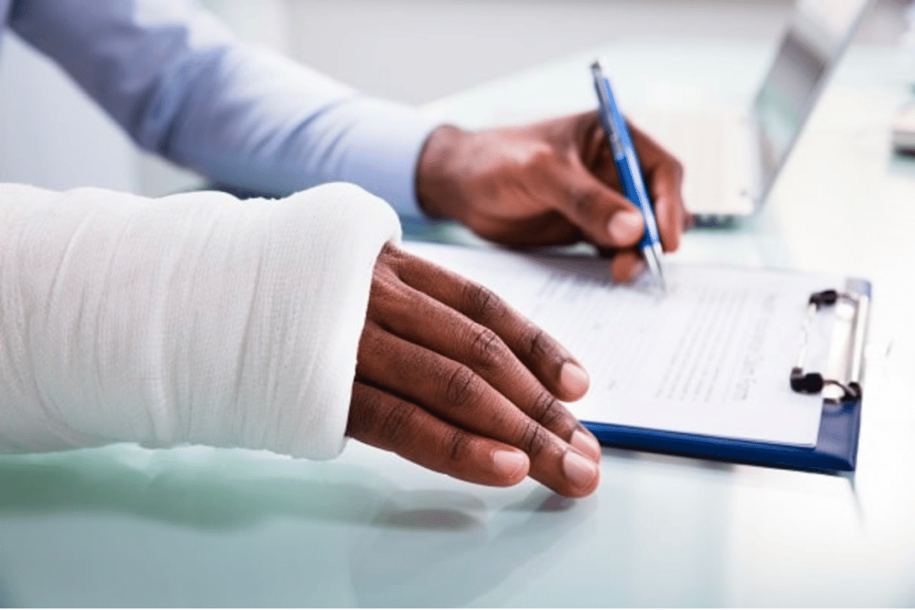 Injured worker filling out workers' compensation form