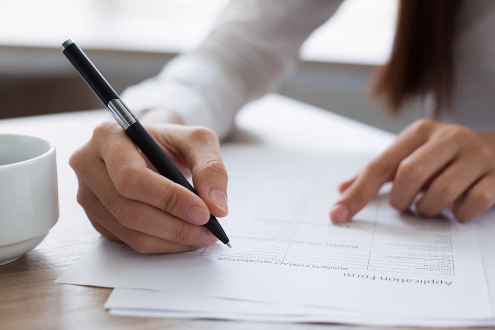 Woman filling out application form