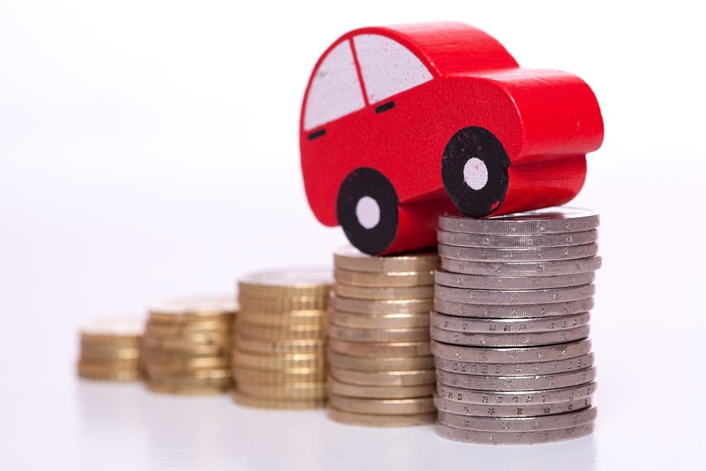 stacking car insurance illustration with coins