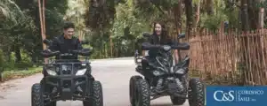 Man and woman riding on an atv