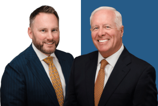 An image of Michael Saile and John Cordisco dressed in suits, both with smiles on their faces, depicting a scene of success or satisfaction in their professional lives as lawyers - Personal injury lawyers serving Bucks County, Philadelphia, and other local areas in Pennsylvania