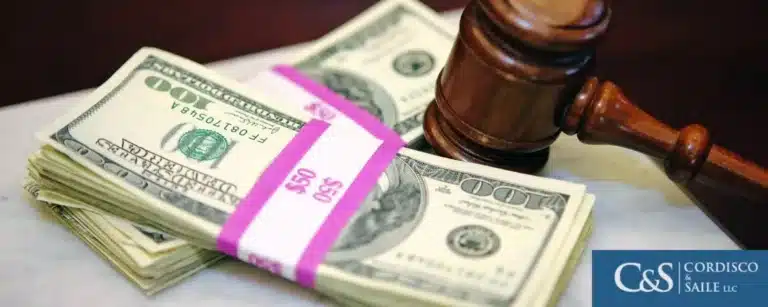 Gavel and a stack of US dollars