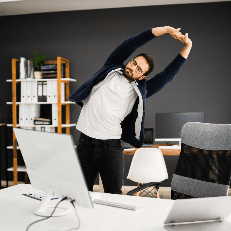 Man stretching in the office