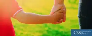 Parent holding a child hands