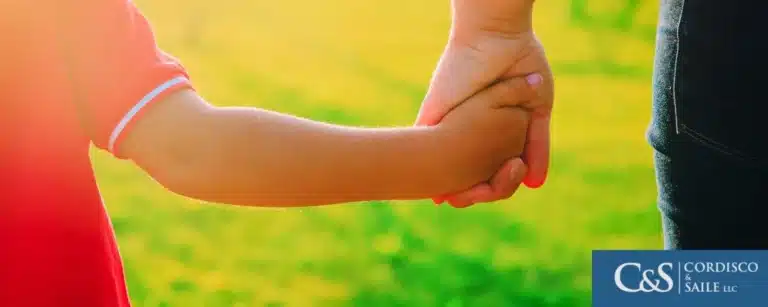 Parent holding a child hands