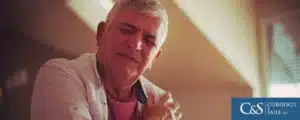 Man holding shoulder in pain after a car accident