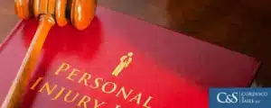 Personal injury law book and a gavel