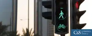 Traffic light displaying red alerting pedestrians , bicycles to pass