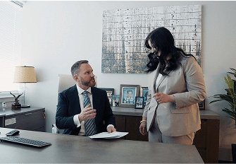 Attorney talking to a woman about client injuries