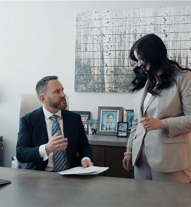 Attorney Michael Saile talking to staff member