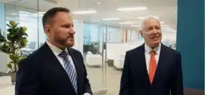 John Cordisco and Michael Saile talking to client