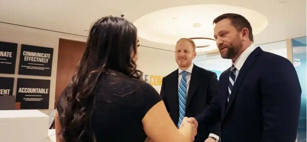 Steven DeBonis and Todd Sailer shaking hands with client
