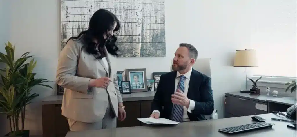 attorney talking about accident case with staff