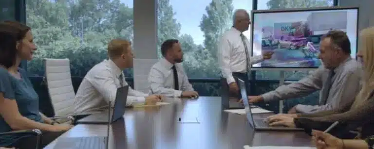 attorneys gathered in conference room discussing a case