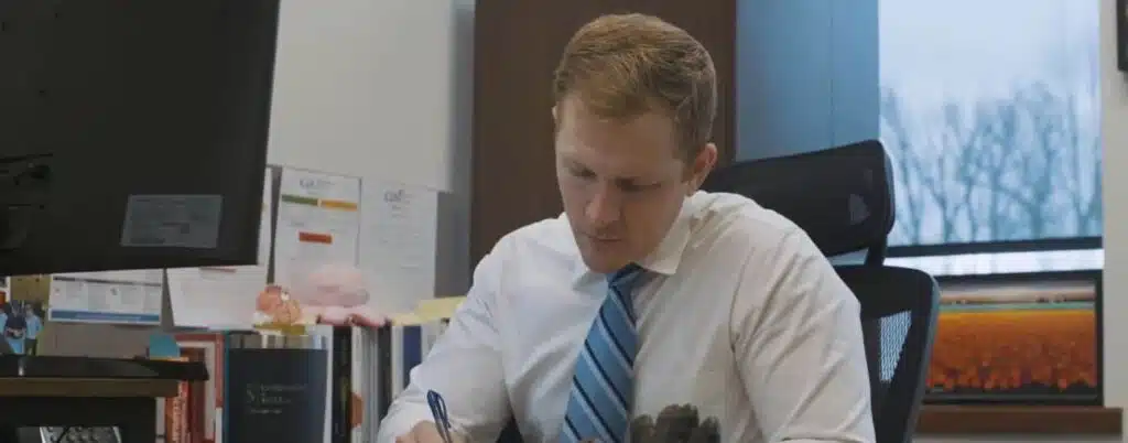 lawyer taking notes at desk