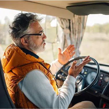 person talking while sitting at the wheel