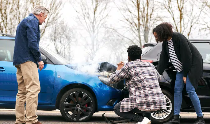 people taking photo of vehicle damage