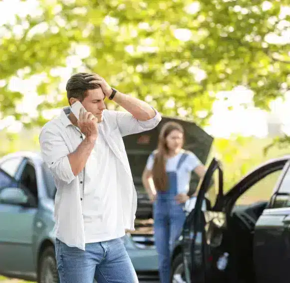 man on phone after car accident
