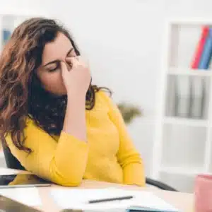Person holding head after concussion