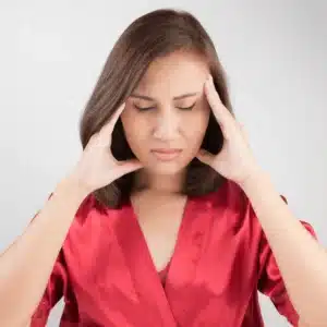 person holding head in hands