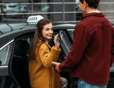 person getting into taxi
