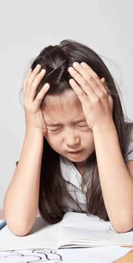 frustrated child with head in hands