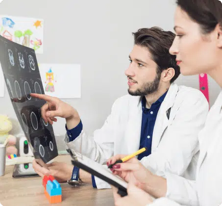 doctors analyzing brain injury data