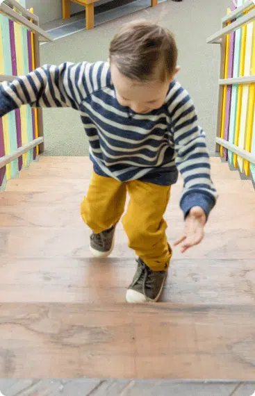 child walking up stairs
