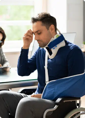 person with neck injury sitting with attorney