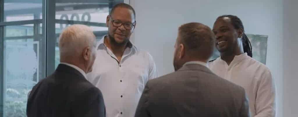 attorneys talking to clients in form lobby