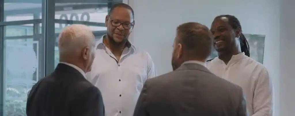 attorneys talking to clients in form lobby