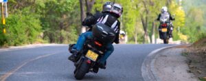 people-riding-motorcycles-and-driving-on-road