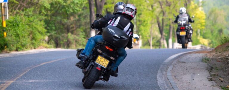 people-riding-motorcycles-and-driving-on-road