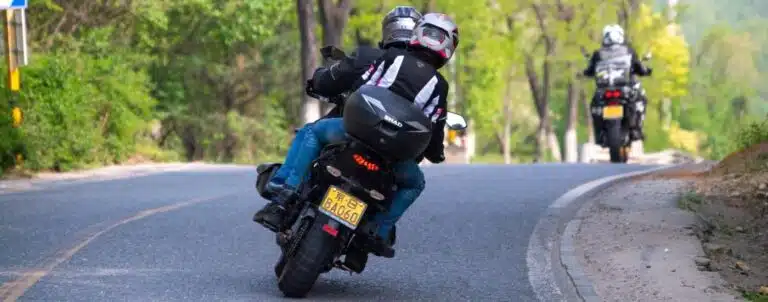 people-riding-motorcycles-and-driving-on-road