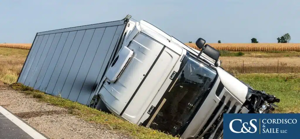 truck turned over on the side of the road