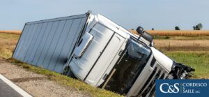 truck turned over on the side of the road