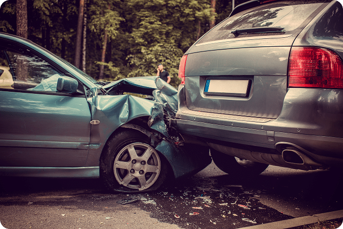 Blue car crashed into a black car